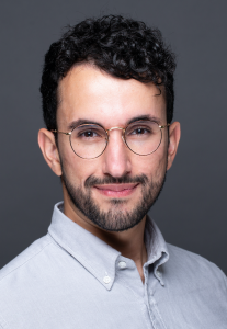 Hossein Ayazi headshot on grey background