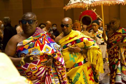 Asante King and escorts walking into the Distler Theater