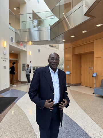 Kwasi Ampene standing in Granoff lobby