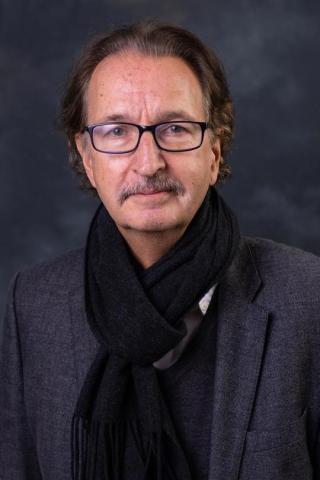 Peter Probst in a grey jacket and black scarf