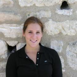 Erica Jones standing in front of a brick wall