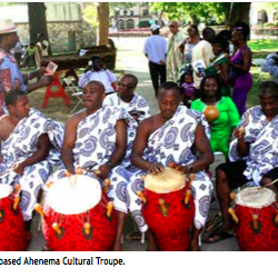 drummers on the street wearing blue and white robes