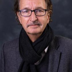 Peter Probst in a grey jacket and black scarf