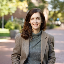Mary Mattingly standing outdoors on a stone path