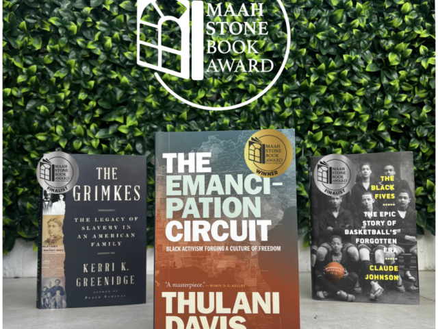 three books on a table with green background and book award logo above it