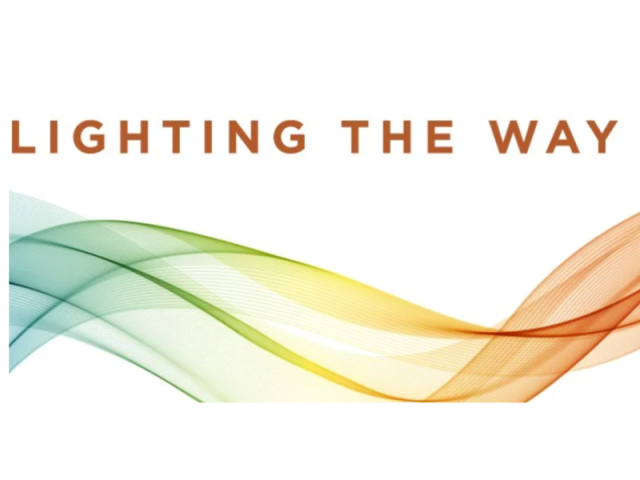 rainbow ribbon with text "lighting the way" above it