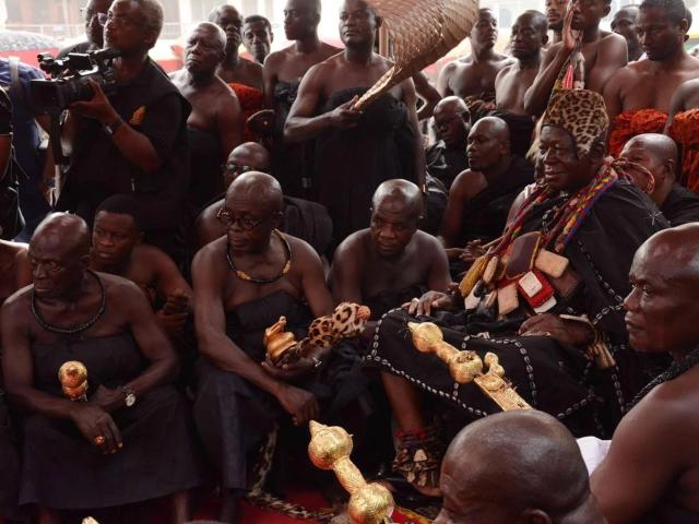 Asante Tribe members sitting in a circle