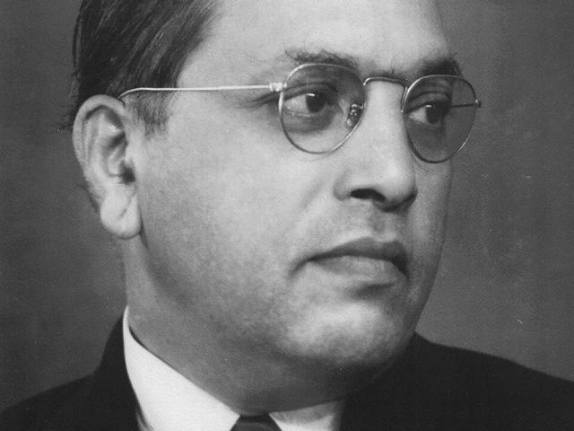 black and white image of B.R. Ambedkar in a suit and tie, looking to the right